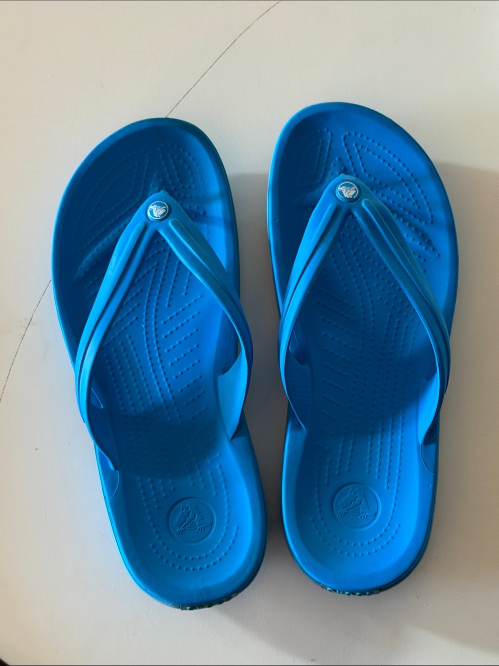 CROCS blue flip flops.  Men’s size 10. Fair condition.